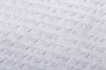 White seersucker fabric made from 100% cotton, provides a light with comfortable feel. Its puckered texture makes it stylish and modern and is ideal for hot weather, combining style and breathability.