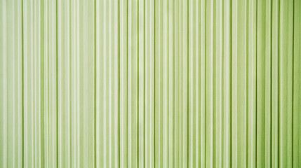 Obraz premium Textured narrow ribbed green paper design with light gradient for creative projects