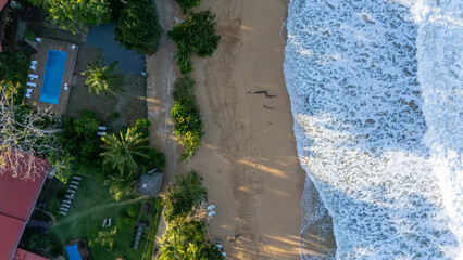 Drone Aerial view at sunrise of the beautiful Oasis Bluff Beach hotel and Bluff Beach in Isla...