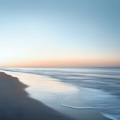Obraz premium A serene beach at dawn with the first rays of sunlight gently illuminating the water, creating a calm and peaceful atmosphere.