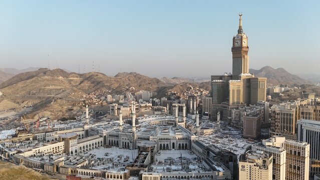 Mecca , Saudi Arabia Mars 30 2024: Makkah city Streets hotels and transportation Makkah Clock Tower - Masjid Al Haram drone aerial view