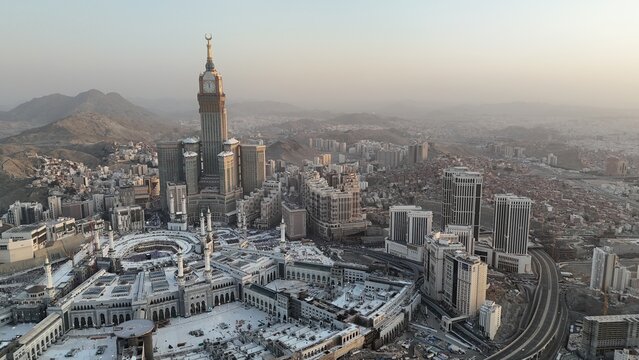 Mecca , Saudi Arabia Mars 30 2024: Makkah city Streets hotels and transportation Makkah Clock Tower - Masjid Al Haram drone aerial view