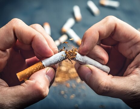 homme cassant une cigarette entre ses mains, pour l'arr&ecirc;t du tabac en ia