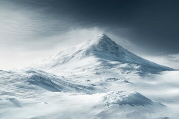 Snow-capped mountain peak under a cloudy sky in a winter landscape