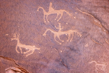 Ancient prehistoric indian Anasazi petrographs showing pictoral stories on the walls of Canyon de Chelly in Ariozona, USA on 19 April 2024