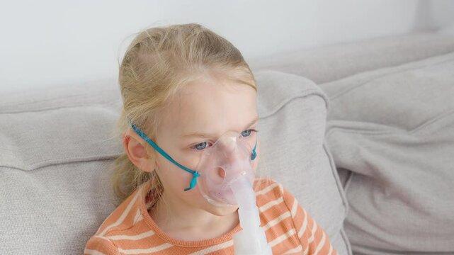 Child receiving nebulizer treatment at home for pneumonia, highlighting the impact of polluted air