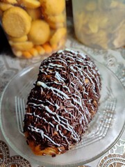 A bread with chocolate sprinkles toppings