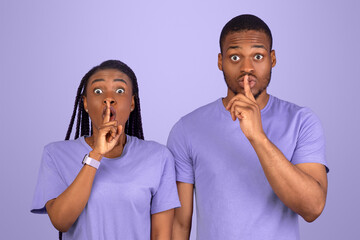 Shh, Keep Silence Concept. Emotional Black Couple Gesturing Hush Sign Posing Standing Isolated Over...