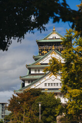 Fototapeta premium Osaka Castle, Osaka city, Japan, summer landscape vibrant view with a blue sky, Osakajo castle building, Kansai region, Osaka prefecture, travel to Japan