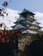 Fototapeta premium Osaka Castle, Osaka city, Japan, summer landscape vibrant view with a blue sky, Osakajo castle building, Kansai region, Osaka prefecture, travel to Japan