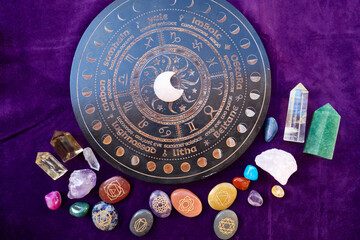Gemstones minerals stones and obelisks over astrology desk. Witchcraft, herbal medicine and...