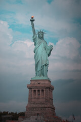 Close-up view of the Statue of Liberty in New York City, highlighting its iconic torch and face.