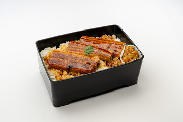 Unaju: A Traditional Japanese Dish Featuring Grilled Eel (Unagi) Glazed in a Sweet and Savory Sauce, Served over Steaming Rice in a Lacquered Box (Jubako) with Pickled Vegetables.
