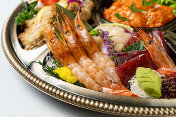 Deluxe Seafood Platter: Assorted Sashimi (Salmon, Tuna, Whitefish), Grilled Shrimp, and Cucumber Garnish, a Japanese Culinary Feast