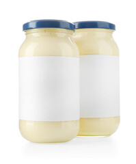 Tasty mayonnaise sauce in glass jars with blank labels isolated on white
