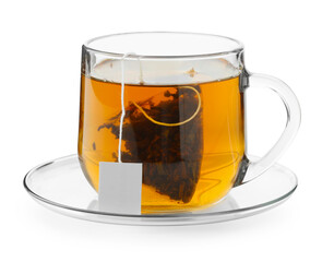 Tea bag in glass cup with hot drink isolated on white