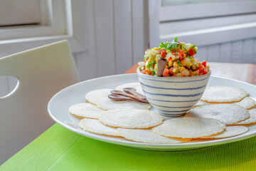 Delicious shrimp ceviche with casabe con on white plate