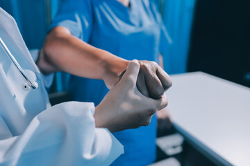 Orthopedist examining patient in hospital