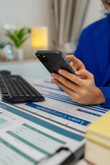 businesswoman sitting by the window with mobile phone at startup office, connection and woman typing on a phone for communication, female entrepreneur with smart phone and laptop working in office