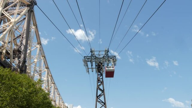 New York City Roosevelt Island tramway to Manhattan Midtown. American aerial cable tram near Queensboro Bridge. Urban public passenger transport, USA. Transportation and architecture in United States.