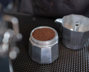 Espresso in Moka pot coffee on table.