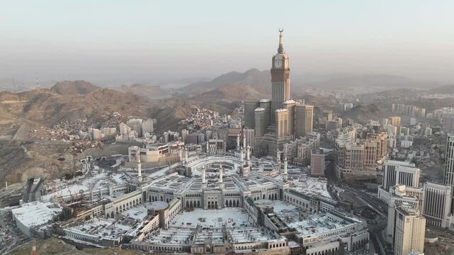 Mecca , Saudi Arabia Mars 30 2024: Makkah city Streets hotels and transportation Makkah Clock Tower - Masjid Al Haram 4k drone Video - aerial view