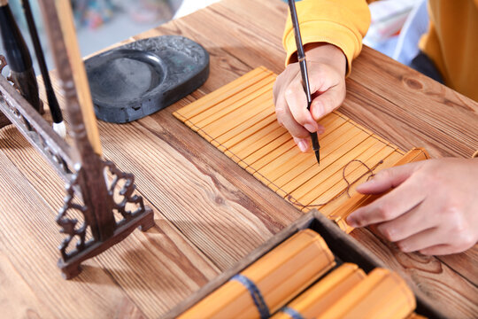 The writer recorded on bamboo slips with a brush