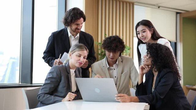 Team of diversity business people are discussing over the new strategic strategy project on investment real estate while working in modern office building for new project and planning