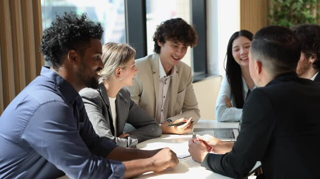 Team of diversity business people are discussing over the new strategic strategy project on investment real estate while working in modern office building for new project and planning