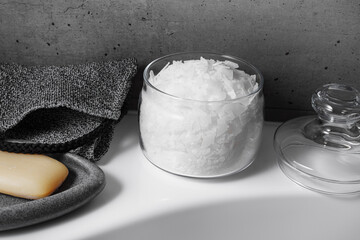 Spa, relaxation, and beauty themes photo, natural magnesium salt, soap, exfoliating loofah in...