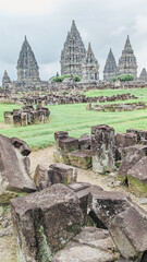 Straight angle view. Scattered solid masonry with the bacground of Prambanan Temple Central Java, Indonesia