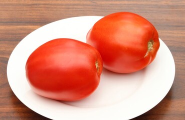 Red Kenosha tomatoes on a white plate