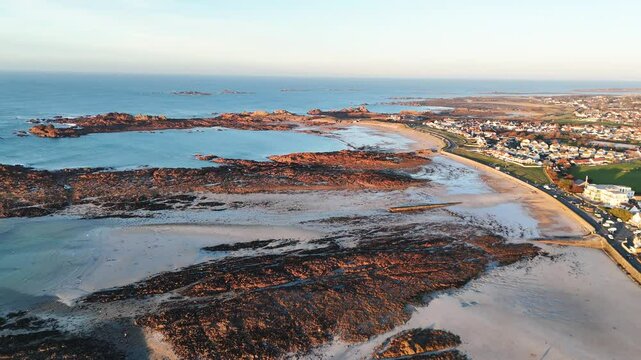 Drone reveal shot of cobo beach Guernsey at low tide 21