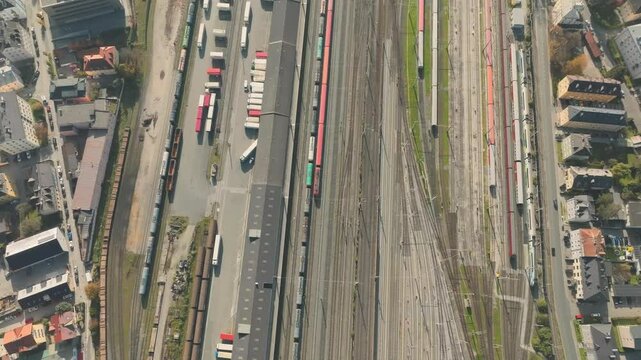 Salzburg Drone, Austria. Aerial View of Central Train Station and Cityscape and misty mountains, top down
