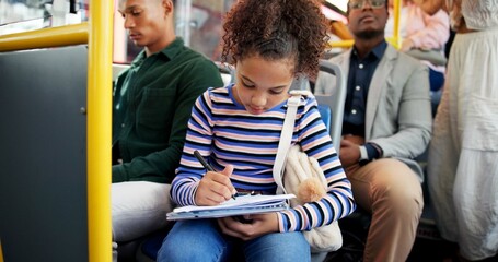 Little girl, writing and bus with book for homework, assignmment or travel to school in city. Child, kid or young student with notebook in public transportation for assessment, project or learning