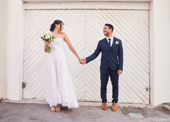 Holding hands, wedding and bride and groom in city for marriage, ceremony and commitment. Happy,...