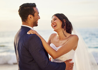 Wedding, happy and couple on beach laugh for celebration, ceremony and marriage. Love, nature and man and woman by ocean together for romantic event, commitment and promise for relationship outdoors