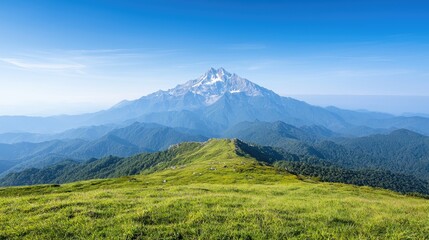 Fototapeta premium Mountain peak view from grassy ridge. Summer landscape, clear sky. Travel poster