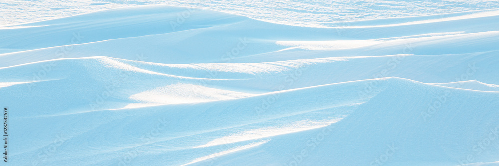 Wall mural snow texture. wind sculpted patterns on snow surface. wind in the tundra and in the mountains on the