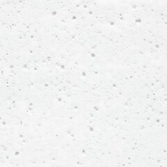 Fototapeta premium A white textured surface with small dark spots scattered
