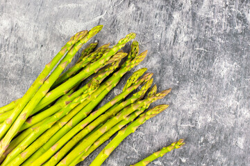 Fresh asparagus on stone background
