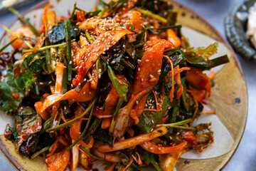 raw gizzard shad salad seasoned with spicy sauce and vegetables