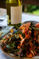 raw gizzard shad salad seasoned with spicy sauce and vegetables
