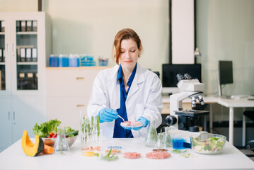 Scientist testing food samples in lab with microscope, vegetables, and meat for safety, nutrition, and biotechnology