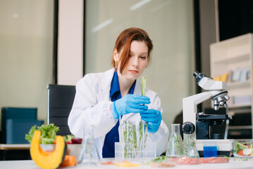 Scientist testing food samples in lab with microscope, vegetables, and meat for safety, nutrition,...