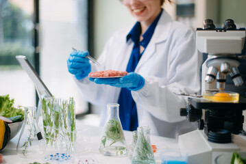 Scientist analyzing food samples in modern lab with advanced equipment for safety, nutrition, and biotechnology research.