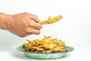 Fried chicken feet (Indonesian called ceker or cakar) with white background
