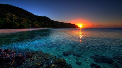 Fototapeta premium Serene sunset over tranquil waters with vibrant colors reflecting on the beach landscape