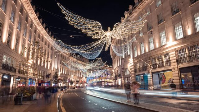Regent Street Christmas Angels Lights with pedestrians, London Buses, and Taxis, time lapse, London, England, UK