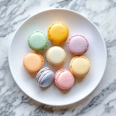 Obraz premium Professional stock photo of a Colorful macaron assortment in pastel shades on a white plate